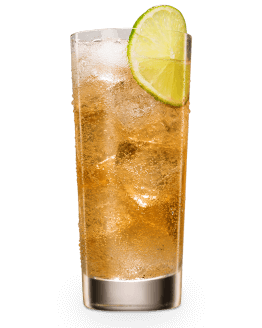 Tall glass with amber cocktail, ice cubes, lime wedge garnish on black background.