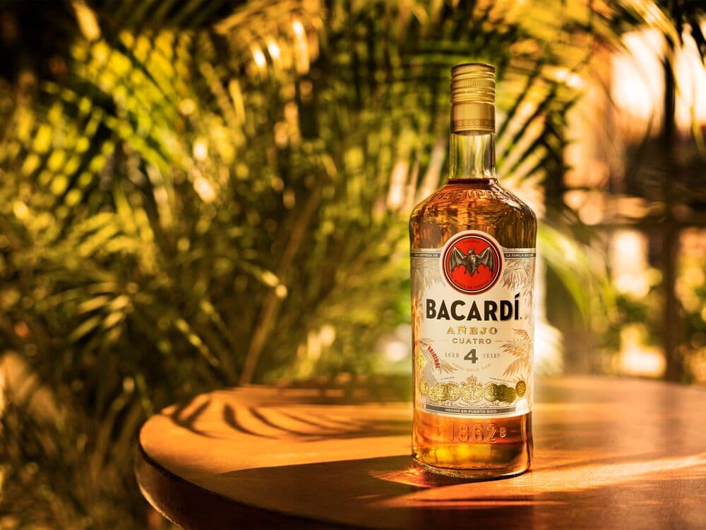 BACARDÍ Añejo Cuatro rum bottle standing prominently.