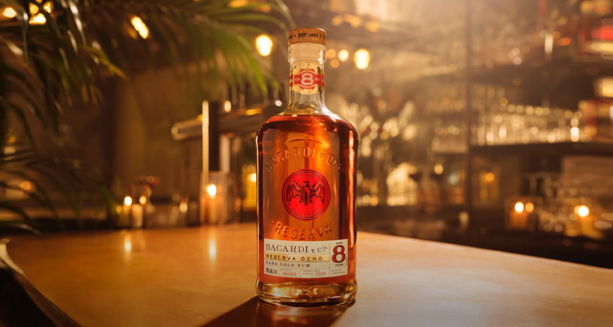 BACARDÍ Reserva Ocho rum bottle with clear label highlighting its Rare Gold Rum designation.