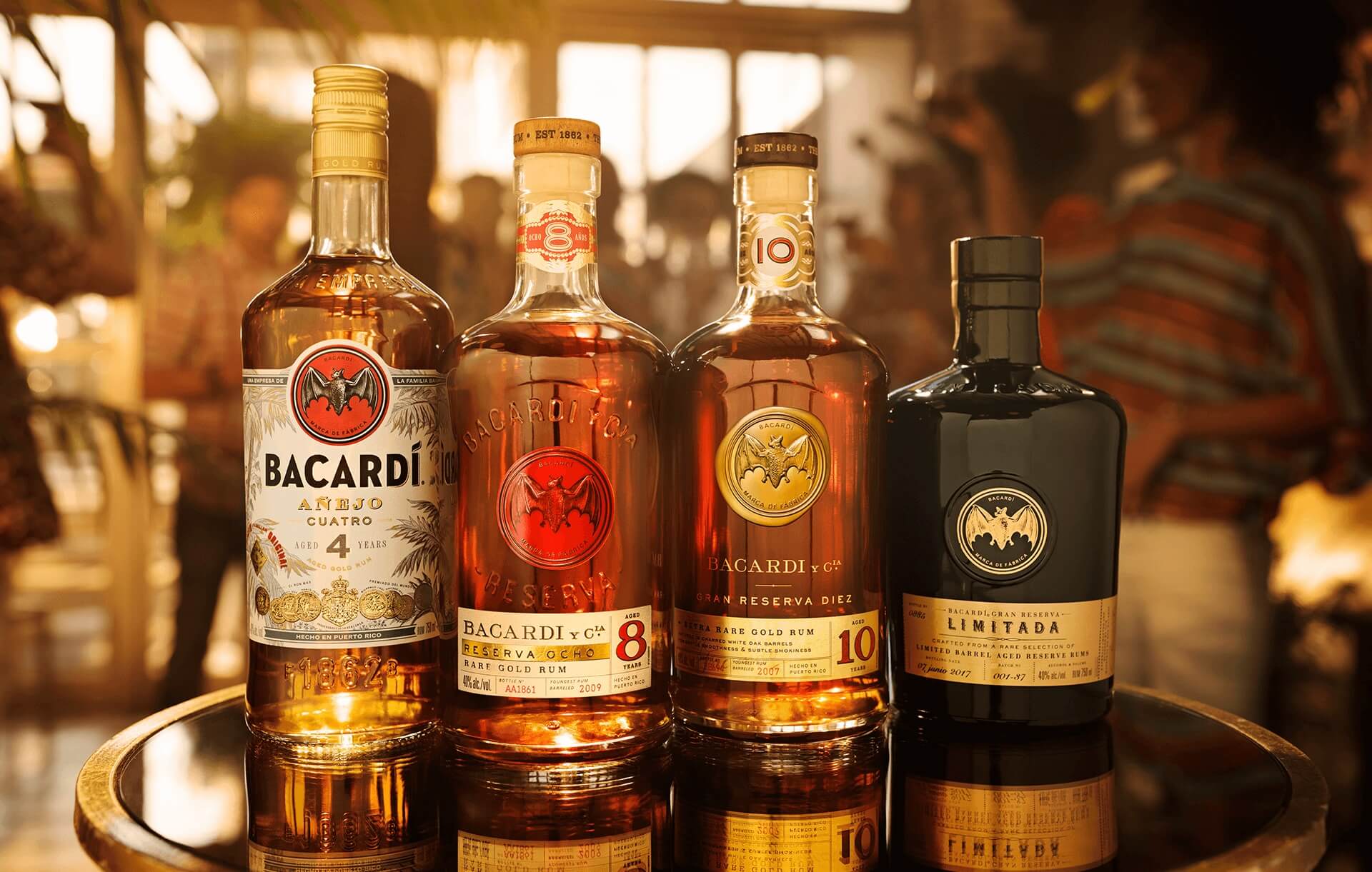 Four BACARDÍ rum bottles showcasing different aged variants: Anejo Cuatro, Reserva Ocho, Gran Reserva Diez, Reserva Limitada.