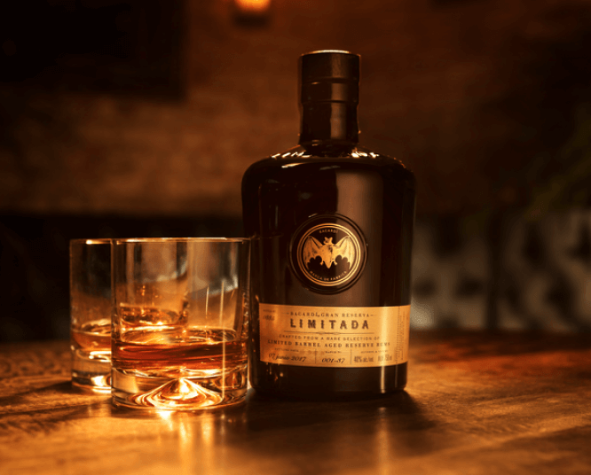 BACARDÍ Gran Reserva Limitada bottle with two glasses of amber rum.