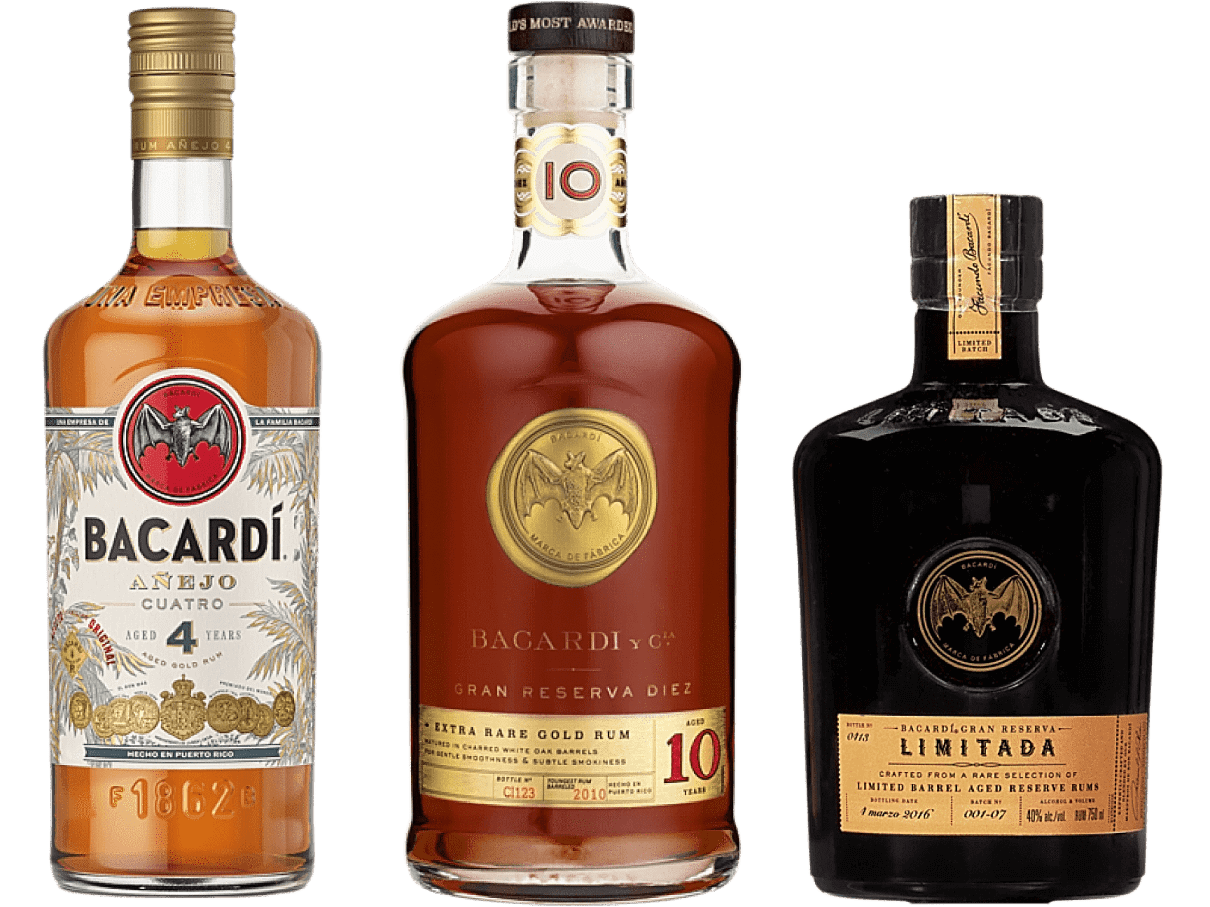 Three BACARDÍ aged rum bottles ranging from light amber to dark, with gold-accented labels.