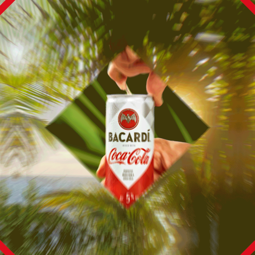Hand opening a BACARDÍ & Coca-Cola can within a dynamic diamond-shaped cutout.